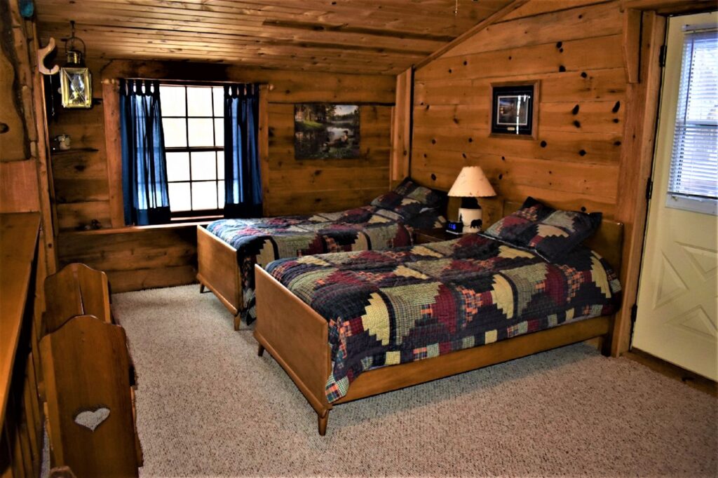 beds in one of the bedrooms at the Shady Oaks cabin